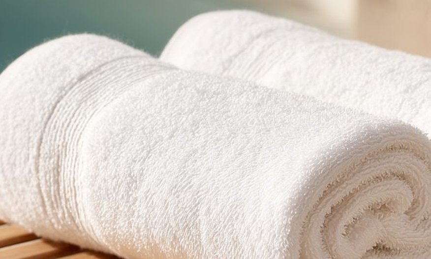Rolled white towels close up